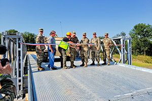 Photo: The 416th Theater Engineer Command Commanding General Maj. Gen. Matthew V. Baker (center) and others officially open the new training site during a ribbon-cutting ceremony Aug. 19 at Fort McCoy.