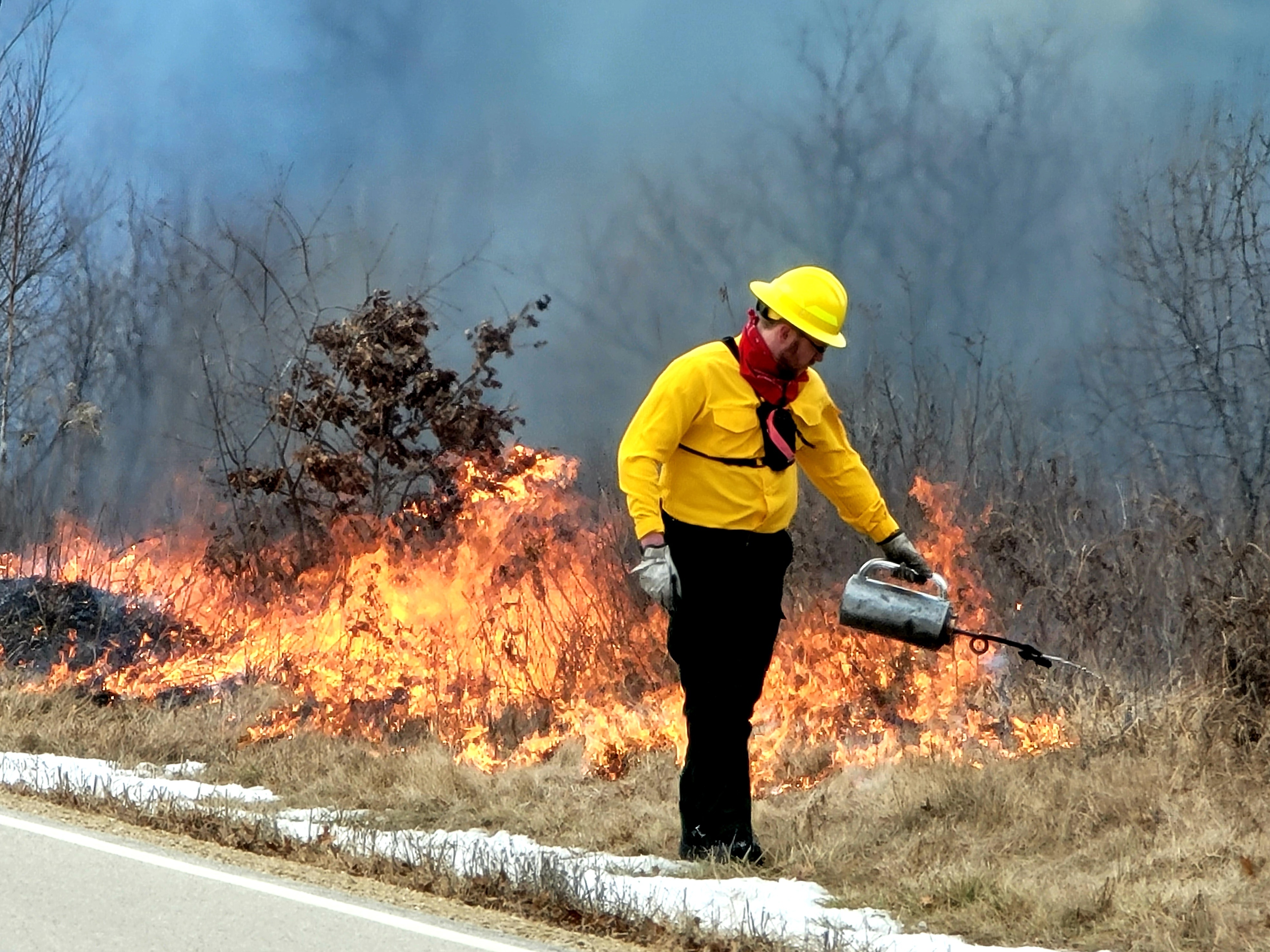 Photo: Team members oversee a prescribed burn March 14 along the railroad tracks on South Post at Fort McCoy.