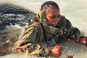Photo: Airman 1st Class Jarva Brown with the 164th Security Forces Squadron at Memphis Air National Guard Base, Tenn., participates in col-water immersion training at Big Sandy Lake on South Post at Fort McCoy.