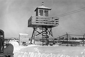 Photo: Views of the prisoner-of-war (POW) camp and a guard tower are shown in the 1940s at then-Camp McCoy. The camp, which was located on South Post, was destroyed after World War II ended.