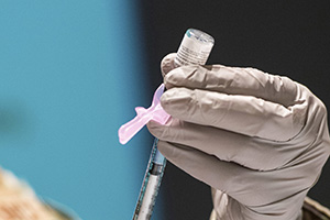 Photo: A technician loads a syringe with the COVID-19 vaccine Jan. 5 at Wright-Patterson Air Force Base, Ohio.