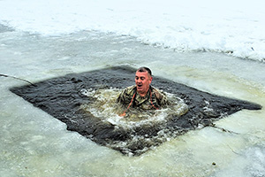 Photo: Garrison Commander Col. Michael D. Poss experiences the shock of ice-cold water Jan. 15 at Big Sandy Lake on South Post at Fort McCoy.