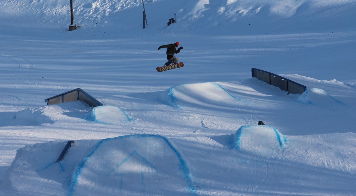 This is a photo of an individual snowboarding at Whitetail Ski Hill at Fort McCoy
