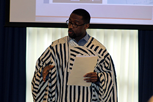 Photo: Momolu Sonie with the Tomah Veterans Affairs Medical Center speaks Feb. 17 at the Black History Month observance. Sonie immigrated to the United States in 1996, serving several tours with the U.S. Army after his immigration.
