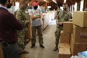 Photo: (From left) Michael Triozzi, with the Department of State’s religious, cultural and spiritual affairs section; Capt. Jamal Bey, a Muslim Imam and an Army chaplain with the 720th Military Police (MP) Battalion, Task Force McCoy; Tim Van Eyck, Task Force Rubicon; and Spc. Michael Mock, religious affairs specialist, 720th MP Battalion, prepare Sept. 21, 2021,to move donated Qurans to prayer centers to give to Afghan evacuees at Fort McCoy as part of Operation Allies Welcome. The Qurans were donated by the Islamic Society of Milwaukee for Afghan evacuees to use.