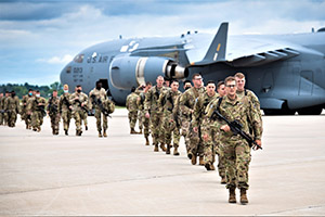 Photo: Soldiers with the 10th Mountain Division disembark from an Air Force C-17 Globemaster III aircraft July 7 during a U.S. Army Forces Command Emergency Deployment Readiness Exercise at Volk Field, Wis.