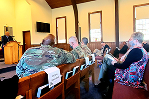 Photo: Retired Wisconsin State Patrol Maj. Darren Price gives his presentation Nov. 4 as the guest speaker for the 2021 Veterans Day Prayer Luncheon at Fort McCoy. Price, a military veteran, is now a pastor with the Tomah Pentecostal Assembly.