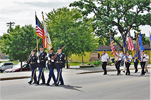 Photo: Color guard marches in a parade.