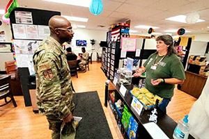 Photo: USO Wisconsin volunteer Judy Adank helps a service member Aug. 5 at the USO office at Fort McCoy. Adank, a Navy veteran and longtime USO volunteer, is one of many who support USO operations at Fort McCoy. USO Wisconsin has continued to expand its presence and support for thousands of service members, families, military retirees, and others every year at Fort McCoy.