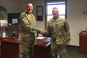 Photo: Garrison Commander Col. Michael Poss (left) welcomes incoming Garrison Deputy Commander Lt. Col. Chad Maynard to his new office July 9 at Fort McCoy.