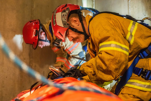 Photo: Firefighters secure ropes during a training rescue mission.