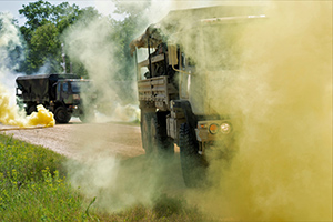A 702nd Engineer Company, 412th Theater Engineer Command, convoy is hit with a notional gas attack following a notional improvised explosive device explosion as part of the 86th Training Division Warrior Exercise 86-21-02 on June 11, 2021, at Fort McCoy, Wis.