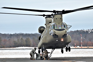 Photo: An aircrew with the 7th Battalion, 158th Aviation Regiment of New Century, Kansas, operates a CH-47 Chinook helicopter Feb. 7 at Fort McCoy to support sling-load training for the 89B Ammunition Supply Course taught at Fort McCoy.