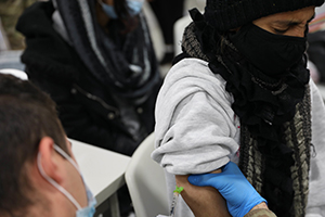 Photo: Spc. Maor Magen, a medic assigned to Task Force McCoy, gives a vaccination Oct. 26 to an Afghan evacuee at Fort McCoy. Task Force McCoy hosted a mass vaccination event to ensure Afghan evacuees are provided with the opportunity to receive the required immunizations and boosters.