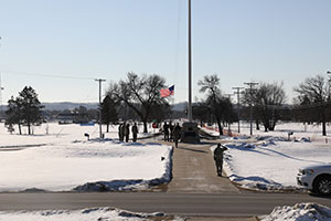 Photo: Military police and Capt. Jamie Horton, a Soldier stationed at Fort McCoy for Task Force McCoy, raise a U.S. flag belonging to Horton over the installation Jan. 20. Horton originally flew the flag in 2002 over the U.S. Embassy in Afghanistan and brought the flag when he was assigned to Fort McCoy in hopes of flying it here.