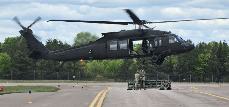Soldiers with 13th Battalion, 100th Regiment hold slingload training at McCoy; Wisconsin National Guard Black Hawks, crews assist