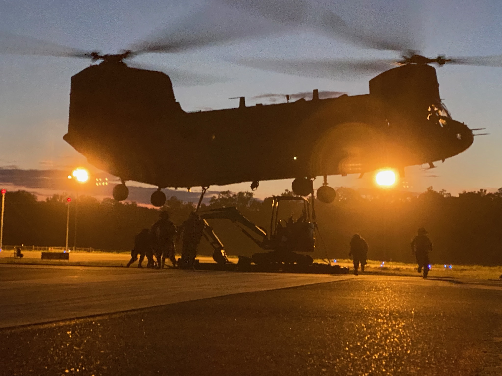 Soldiers of E Co FSC hook up the sling load of non-standard equipment to a CH-47 in support of 326 BEB combat operations