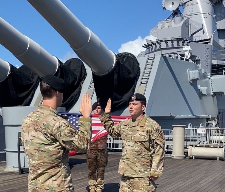 548 CTS Member Reenlists on USS Missouri at JB Pearl-Harbor Hickam, HI