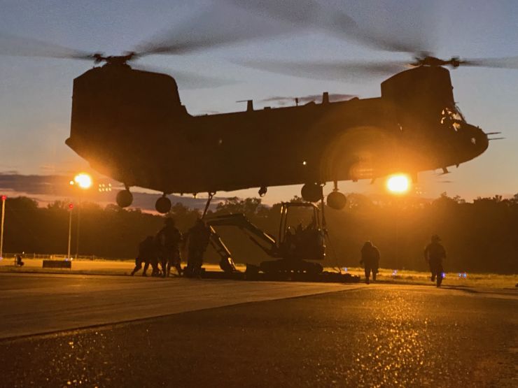 Soldiers of E Co FSC hook up the sling load of non-standard equipment to a CH-47 in support of 326 BEB combat operations