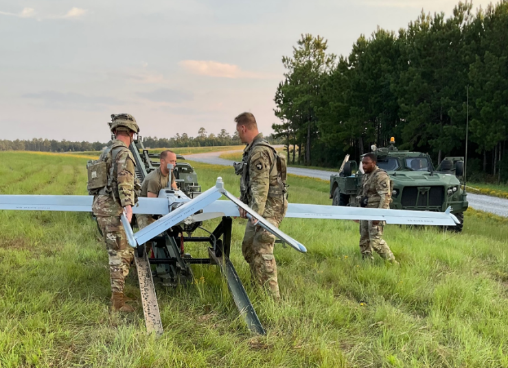 Rotational training unit soldiers load a RQ-7B Shadow on a launcher to support ISR missions