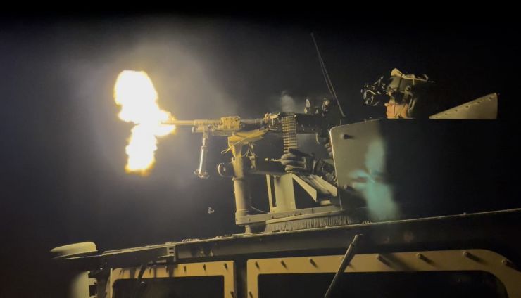A gunner provides a base of fire for the maneuvering element.