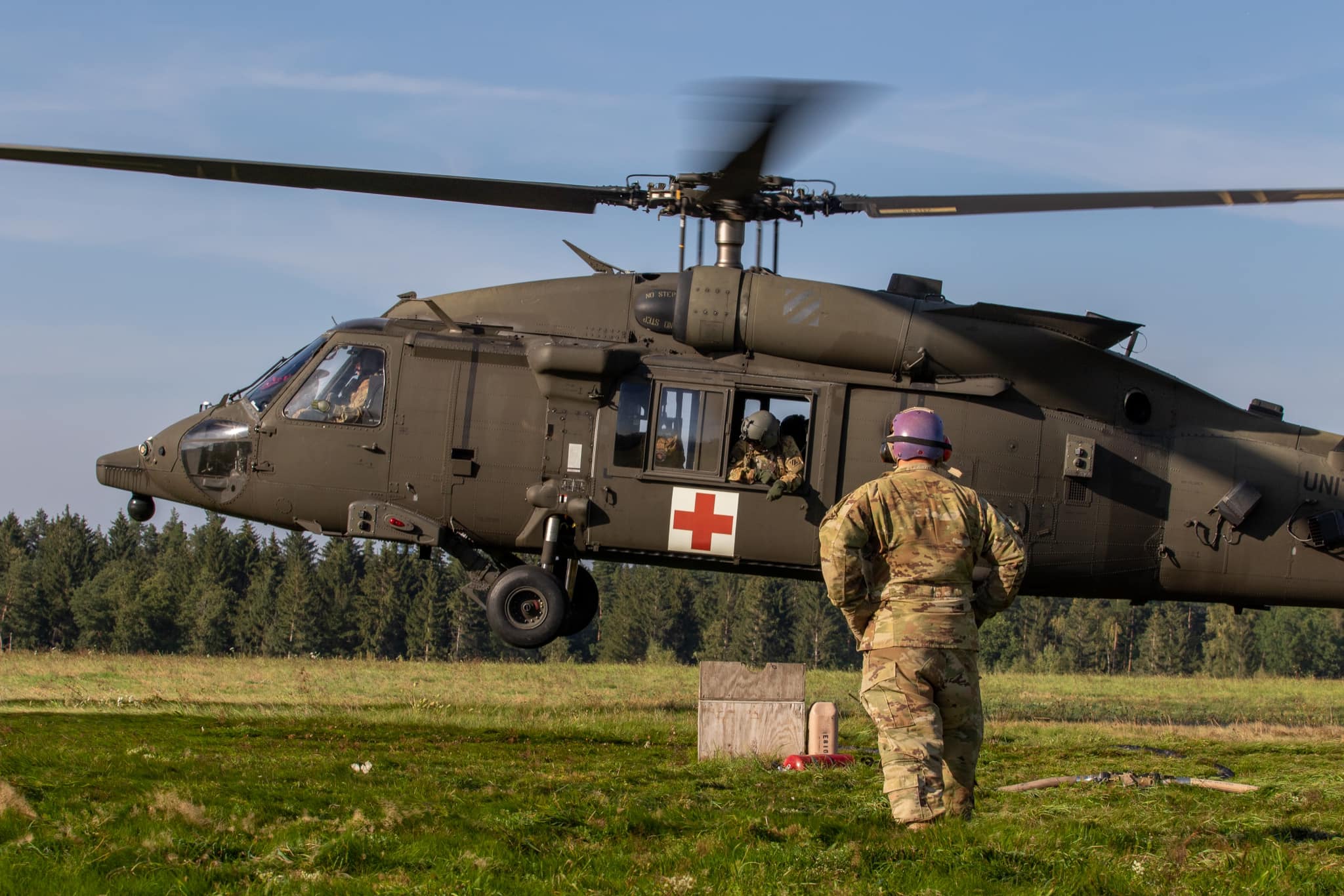 2-3 GSAB support to the USASOC Best Combat Diver Competition CH-47 Chinook helicopter hovers above water while Soldiers are jumping in the water