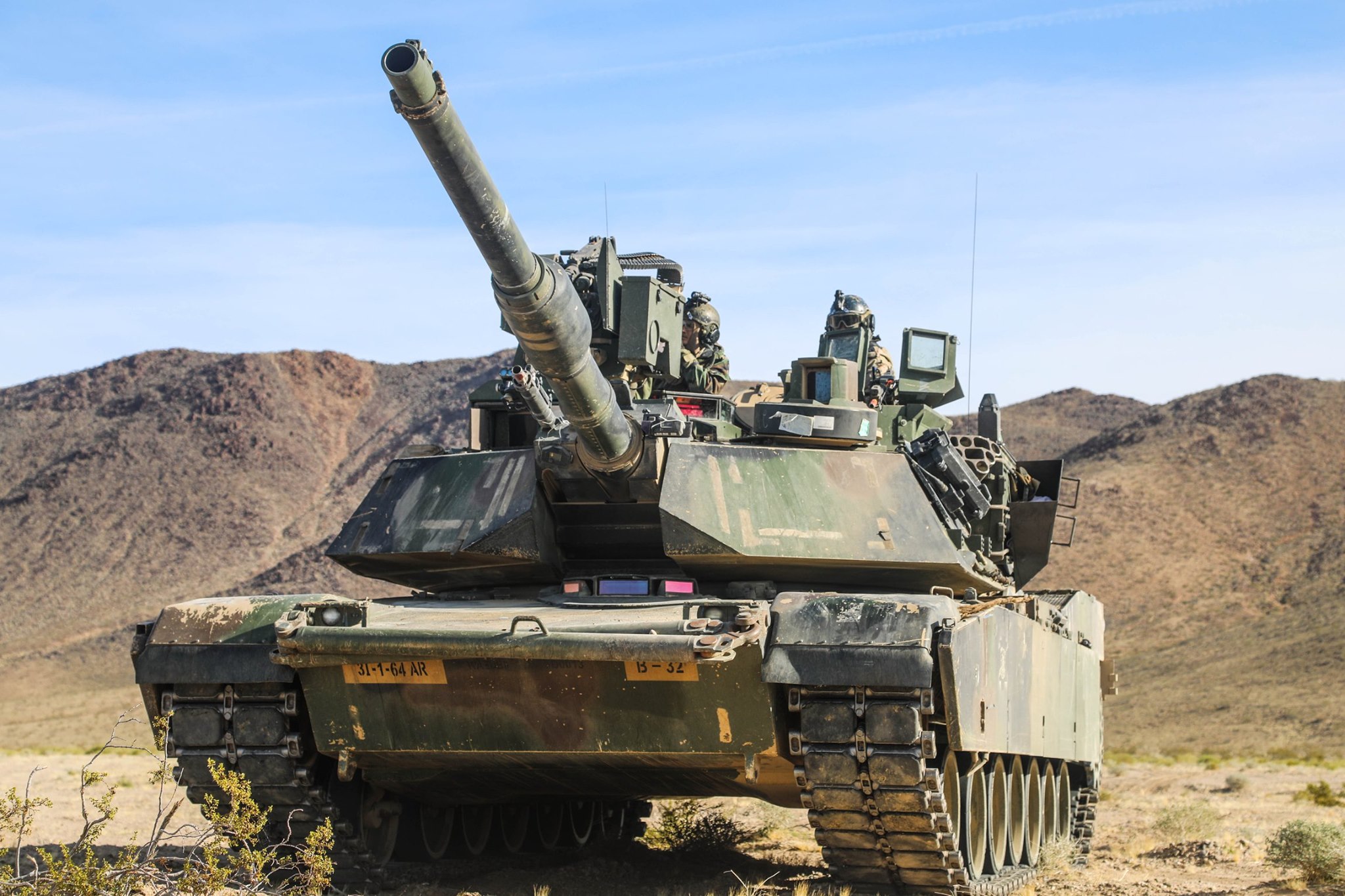 M1A2 tank Crew from  B Company 1st Battalion-64th Armor, 1st Armored Brigade Combat Team, 3rd Infantry Division, conduct combat operations at the U.S. Army’s National Training Center.