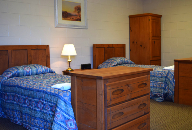 Double rooms: two twin beds, two dressers, one large armoire, kitchen table, desk, and more! Double.jpg
