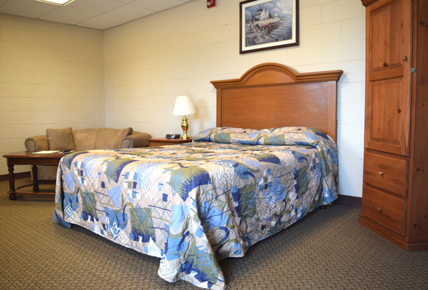 Single rooms: 1 queen bed, dresser, desk, microwave, refrigerator, ironing board, and more! Single room 2.jpg