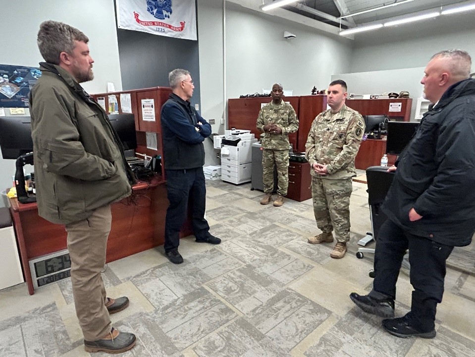 JTF PMO staff and Federal Bureau of Investigation agents discuss ways to implement and improve processes.