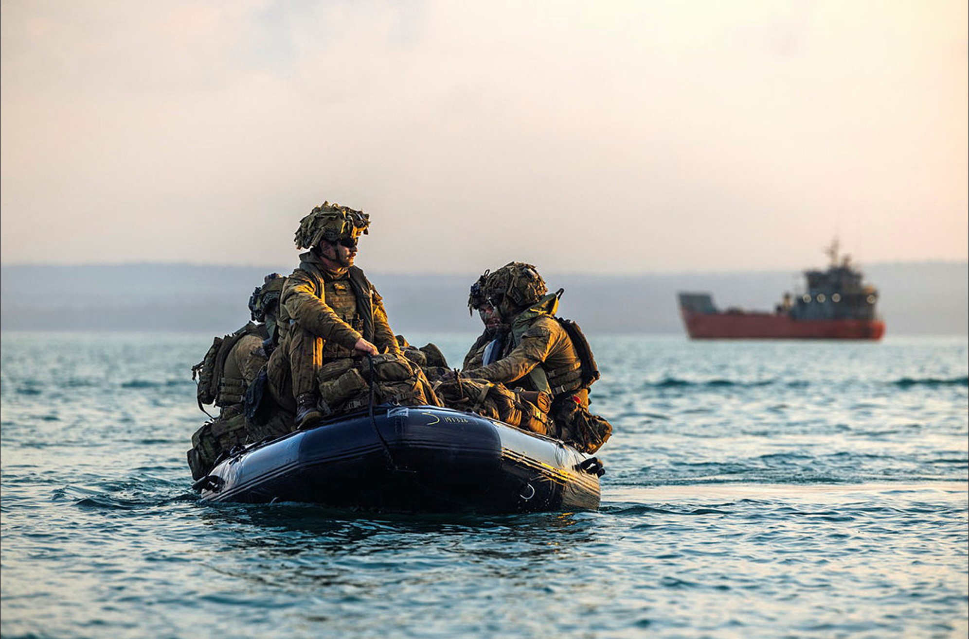Sappers from the 1st Combat Engineer Regiment transit from a parent craft to an island to conduct area clearance prior to disembarking plant equipment to develop survivability positions.