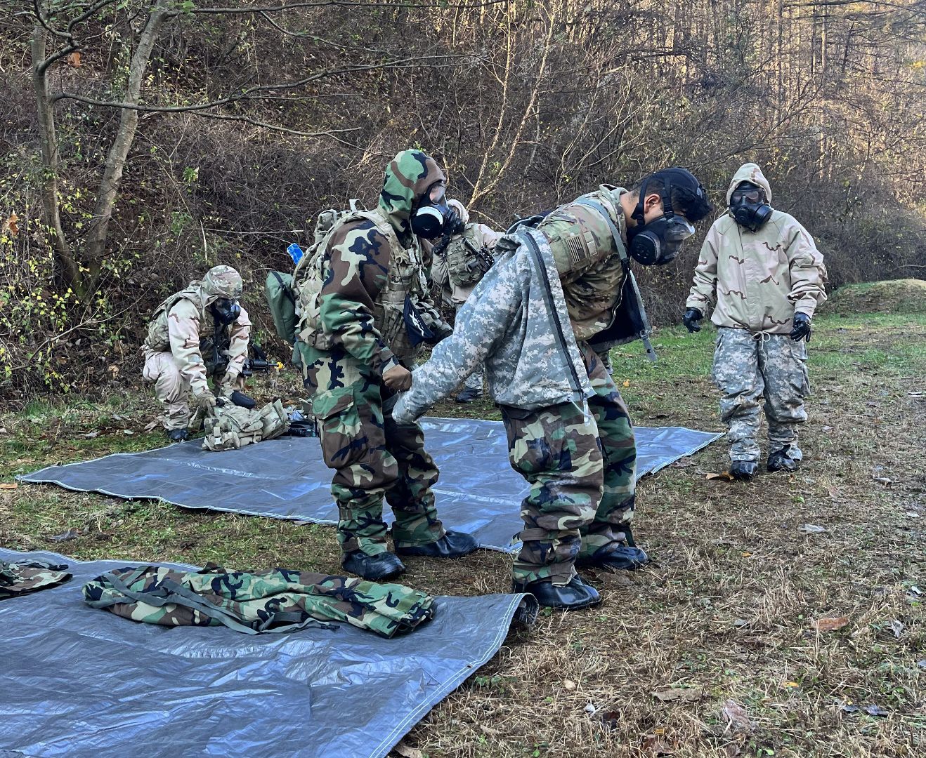 A Soldier conducts MOPP exchange.