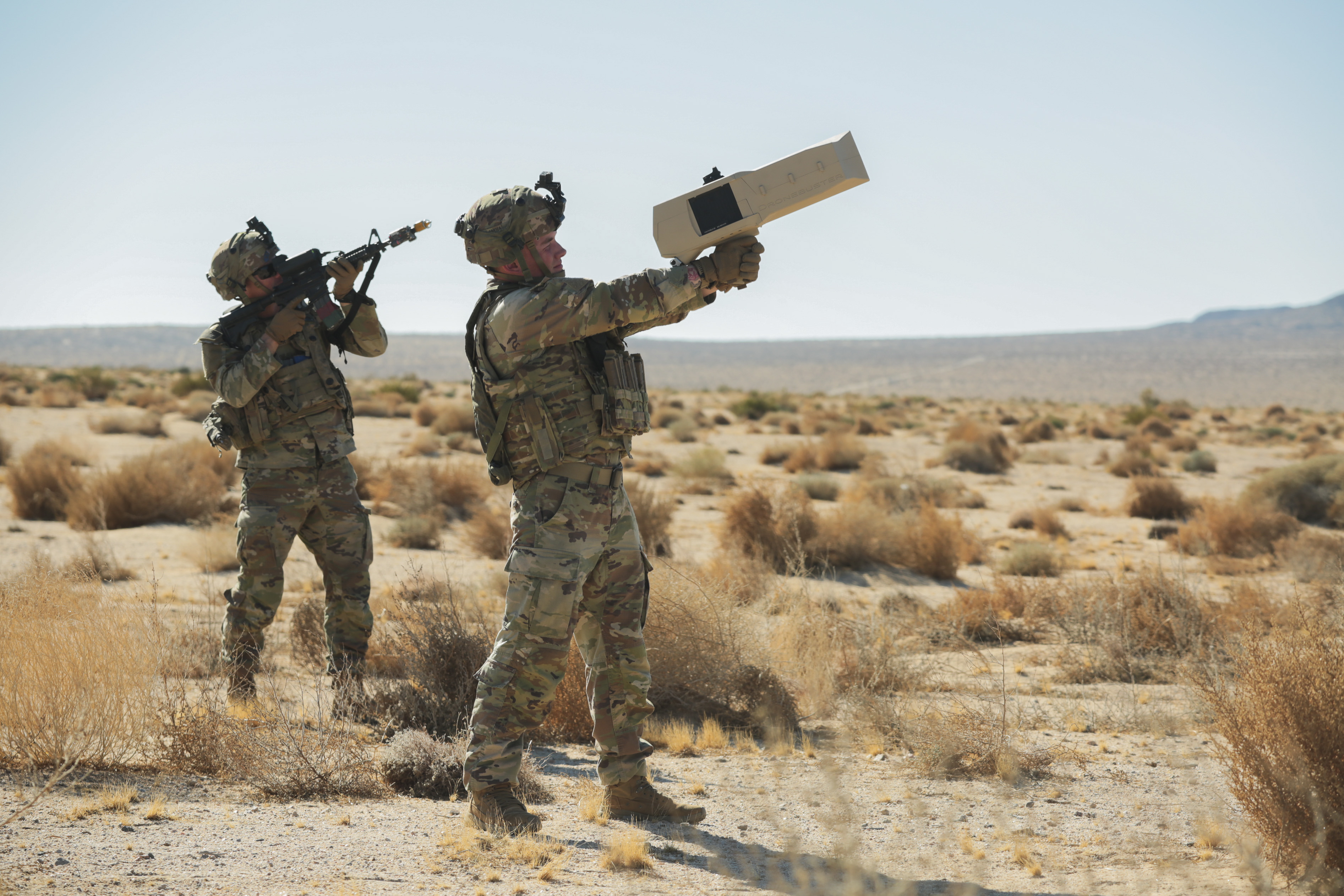 U.S. Soldiers rehearse the use of a Dronebuster to engage enemy targets during Rotation 25-03. (U.S. Army Photo by Specialist Marques Martinez, Operations Group, National Training Center.)