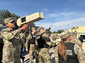 Soldiers employ a Dronebuster during engagement with simulated hostile drones.
